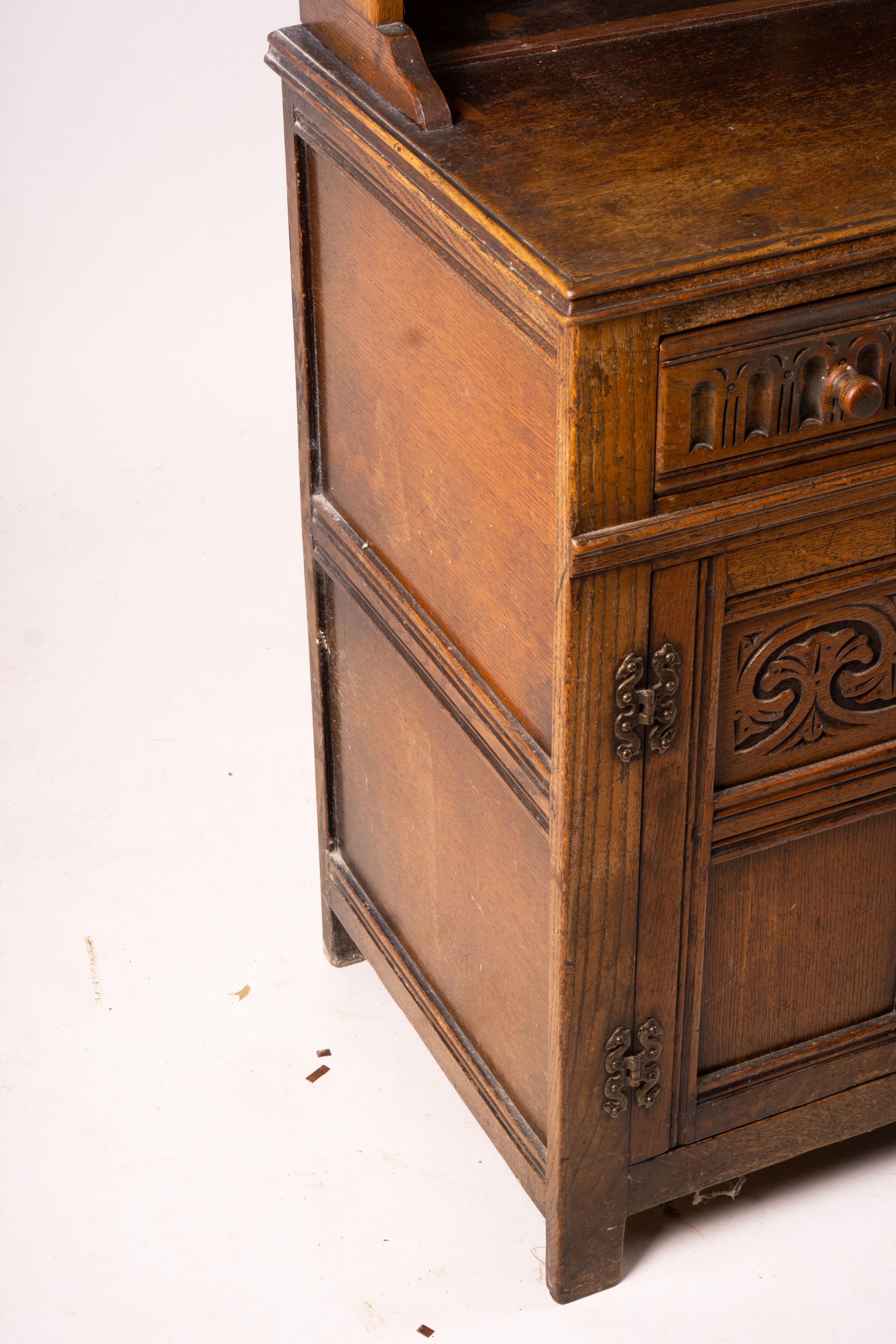 An 18th century style carved oak dresser, width 124cm, depth 46cm, height 175cm